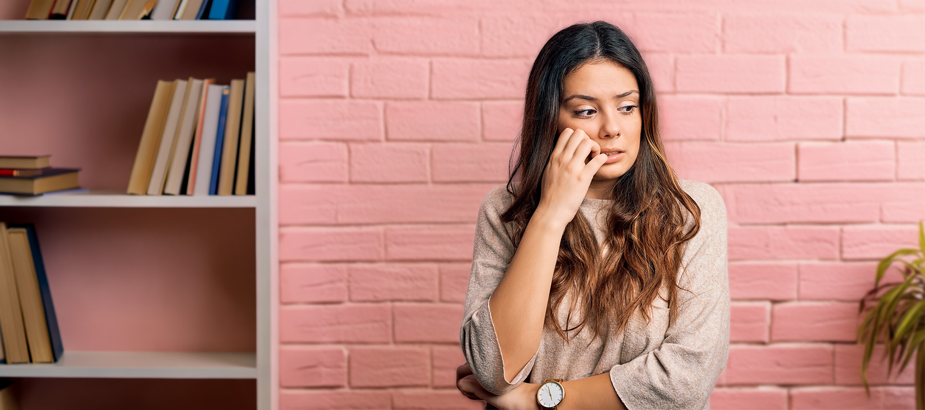Woman sitting peacefully outdoors, representing calm, confidential support